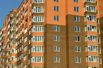 Fototapeta premium The brick multi-storey building