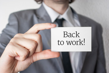 Back to work. Businessman showing business card