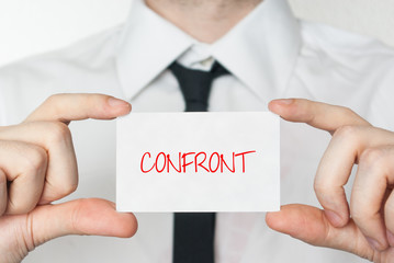 Confront. Businessman holding business card