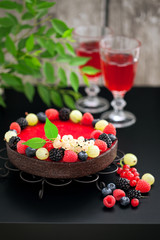 Chocolate raspberry tart with fresh berries, selective focus