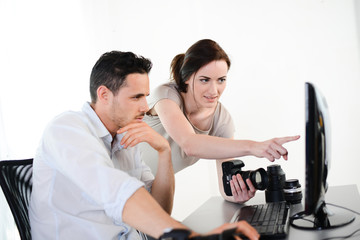 photography student and teacher viewing and editing photos