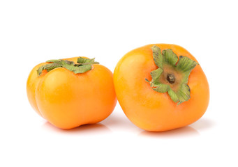 ripe persimmons isolated on white background