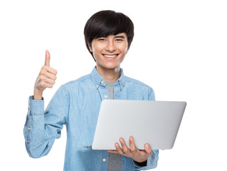 Man with laptop computer and thumb up