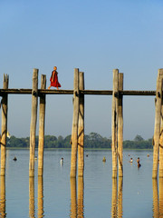 Buddhist monk walking on U Bein bridge, Amarapura, Myanmar