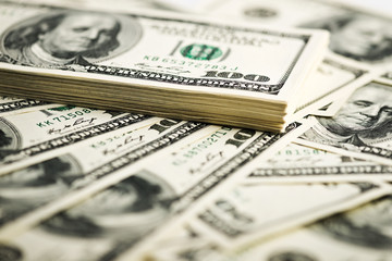 Stack of one hundred dollar bills close-up. (shallow DOF)