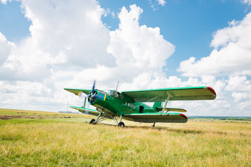 old airplane on green grass