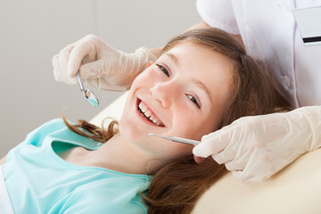 Happy Girl Undergoing Dental Treatment