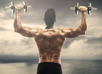 Muscle man lifting weights