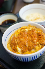 Deep fried pork with egg and rice