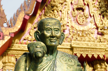 Fototapeta na wymiar a monk statue in Wat Mahaeyong Buddhism Temple in Nakhon Si Tha