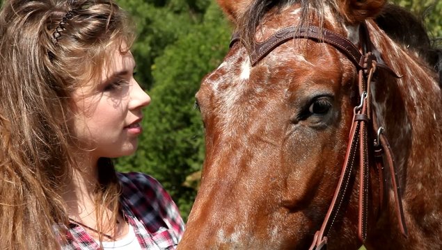 Young woman with horse