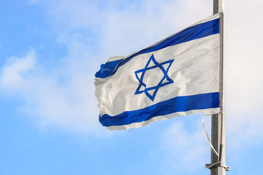 Flag of Israel over the sky