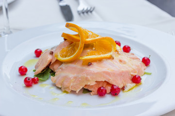 Salmon marinated into orange