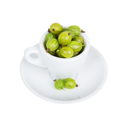 Gooseberries in white cup and saucer