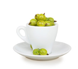 Gooseberries in white cup and saucer