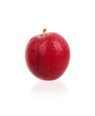 Fresh ripe plums with drops