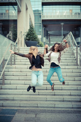 blonde and brunette beautiful stylish young women