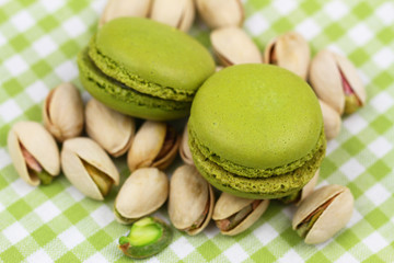Pistachio macaroons on pistachio nuts