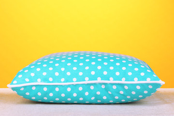 Blue bright pillows on orange background