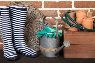 Tools of gardener on  bricks background