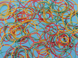 colourful rubber bands on a blue background