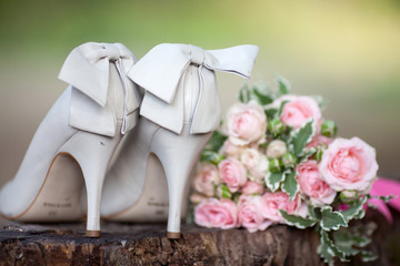wedding shoes with bouquet