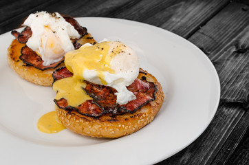Benedict eggs with crispy bacon and hollandaise sauce