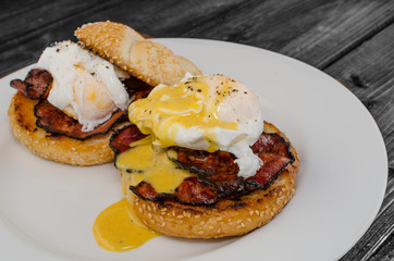 Benedict eggs with crispy bacon and hollandaise sauce