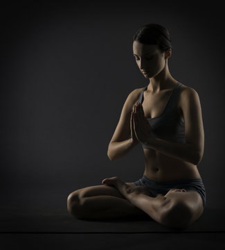 Yoga woman meditate sitting in lotus pose. Silhouette exercise