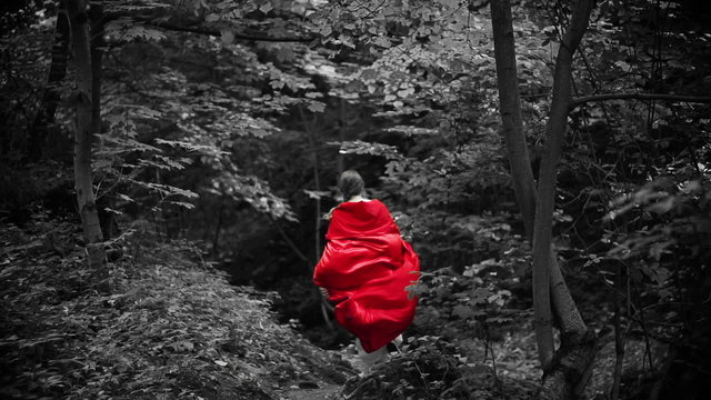 Woman in red cape run away in forest, super slow motion, 240fps