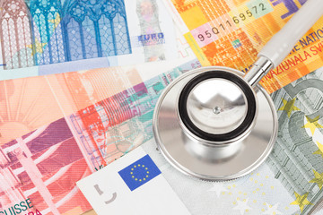 Stethoscope on Europe banknote concept financial health check