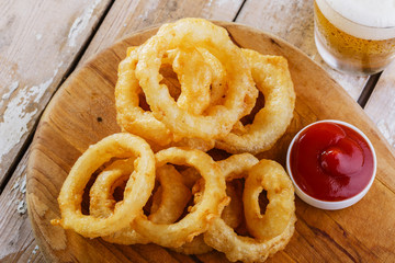 fried onion rings with red sauce