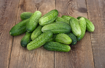 Cucumbers on wooden table.