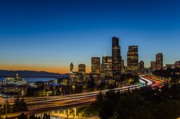Fototapeta na wymiar Seattle Skyline at Dusk with the Freeyway on Foreground