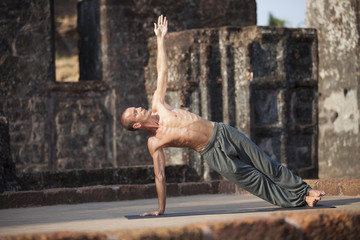 Beautiful yoga position at the ruins of India.