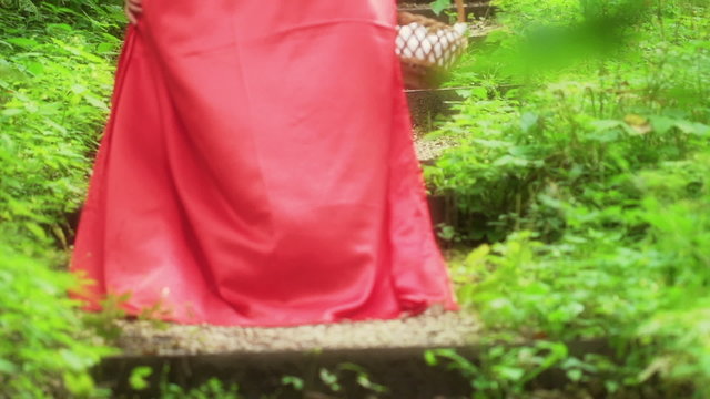 Red riding hood walking in forest, super slow motion, 240fps