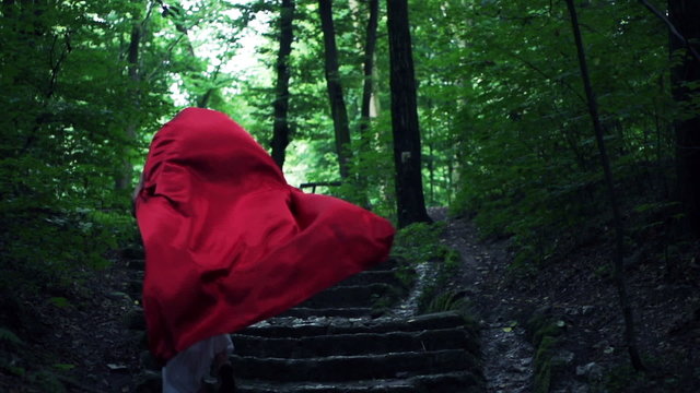 Red riding hood running away in forest, super slow motion, 240fp