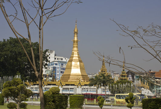 Yangon, its daily traffic and temple in the background