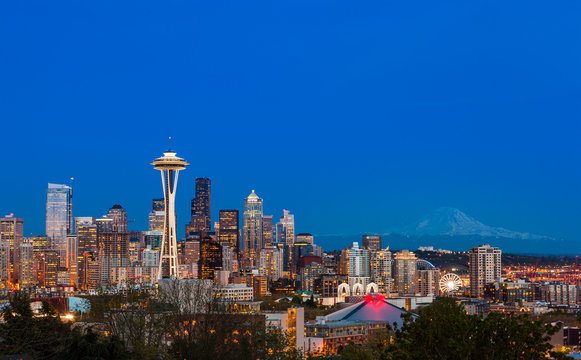 Seattle downtown skyline and Mt. Rainier at night. WA