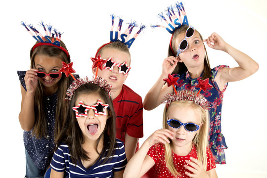 Five cousins dressed patriotic being silly with funny expression