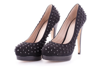 Blck spiked shoes isolated on white background.