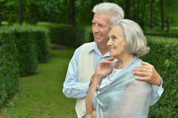 Smiling elderly couple outdoors