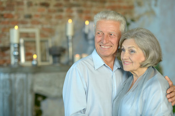 Elderly couple sitting in vintage interior