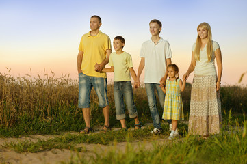 Family walking by road