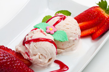Strawberry ice cream with fruits close up