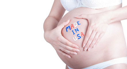 Pregnant belly with "Made in USA" sign isolated