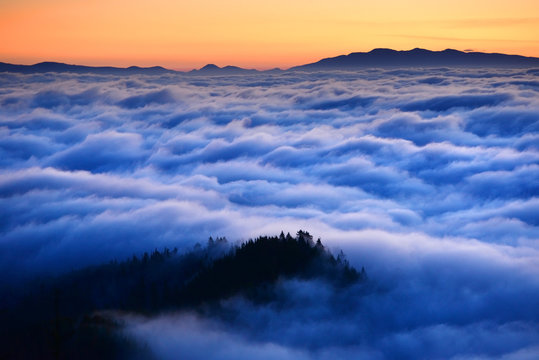 Mountain sea of clouds in sunrise light