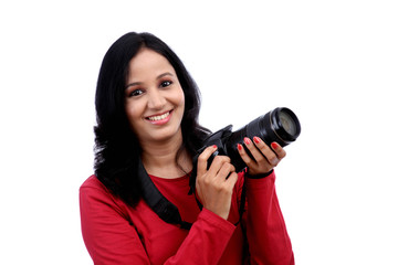 Young woman photographer with camera