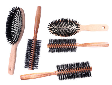 Collage of wooden hairbrushes isolated on white