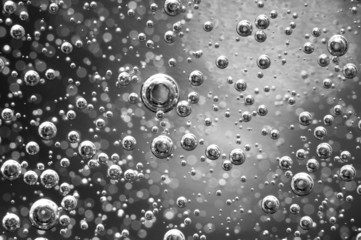 Air bubbles in a liquid. Abstract black-and-white background